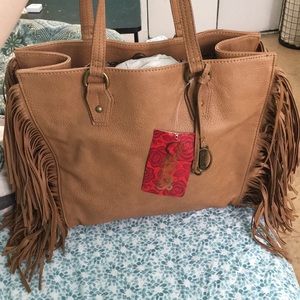 Brown handbag with fringe by Carlos